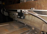 Back of the table, the X axis - notice the "stop" bolt to the left of the readhead bracket - Click for a larger picture!